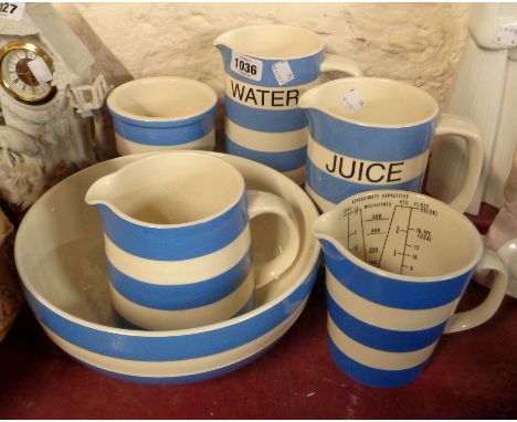 Six pieces of T.G. Green and Cloverleaf Cornish Ware including juice and water jugs, measuring jug, mixing bowl, etc.