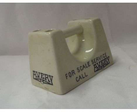 An early 20th Century ceramic advertising pen holder desk weight for Avery Scales, in the form of a cast iron weight
