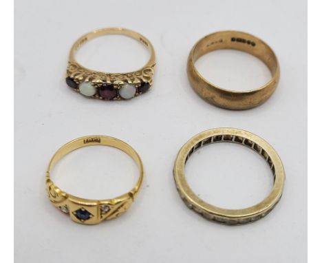 A marked 18ct. early 20th Century ring, set with tiny sapphire and flanking diamond chips - size L - sold with a 375 (9ct.) g