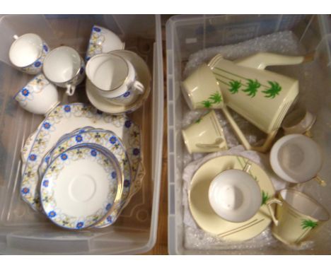 A crate containing a Noritake Art Deco part coffee set with palm tree decoration on an ivory ground - sold with a crate conta