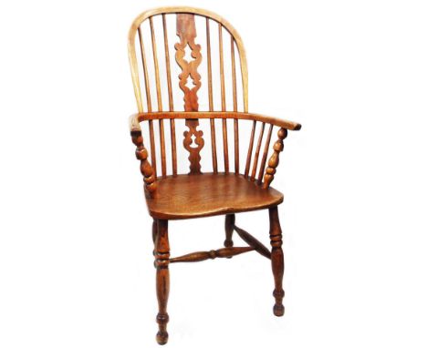 A 19th Century elm and ash Windsor high hoop stick back elbow chair with moulded solid elm seat, set on ring turned supports