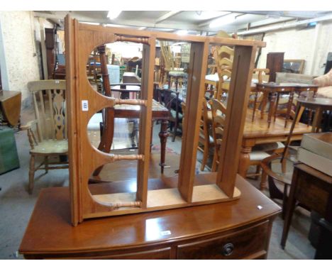 An 80cm modern pine wall mounted three shelf open plate rack with arched top