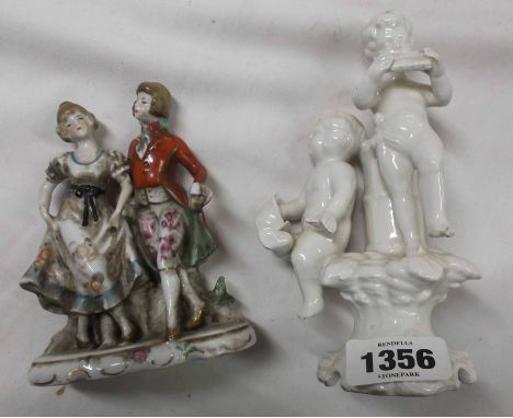 An Italian ceramic figural candlestick, depicting musical putti, made for Casapupo - sold with a German porcelain figure grou