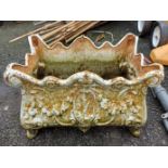 A decorative cast iron planter of rectangular form