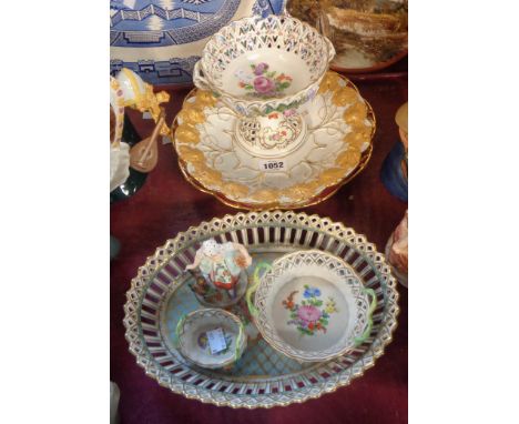 A quantity of Continental porcelain items comprising three Dresden reticulated dishes, a similar comport (a/f), two moulded d