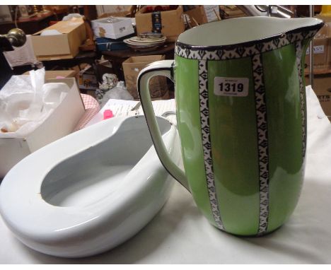 A toilet jug with green and black panel decoration - sold with and old enamel slipper pan