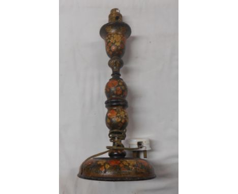 A Kashmiri style lacquered table lamp with floral decoration on a black ground