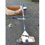 A JCB petrol strimmer