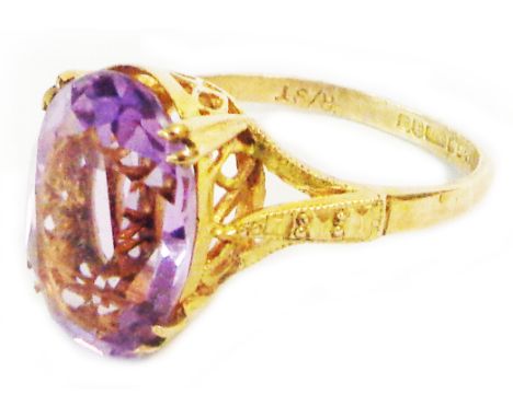 A 375 (9ct.) gold dress ring, set with large oval amethyst - size N 1/2