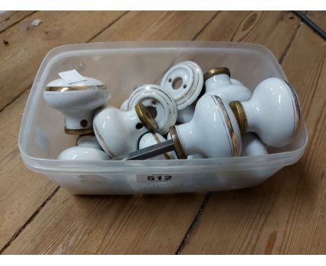 A box containing a quantity of assorted ceramic doorknobs