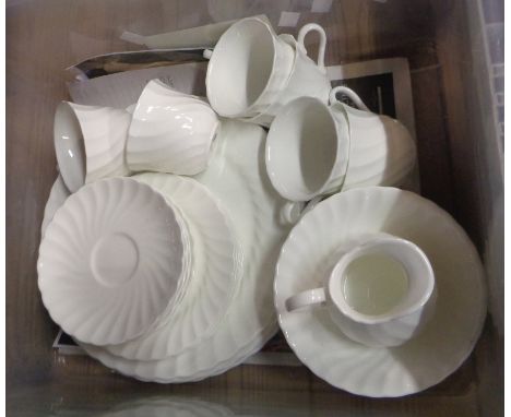 A crate containing a quantity of Wedgewood bone china, white decorated fluted teaware including cups and saucers, plates, etc