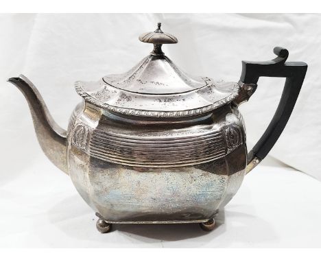 A Victorian silver teapot with gadrooned rim, reeded and embossed decoration, wooden handle and knop, set on ball feet - Birm