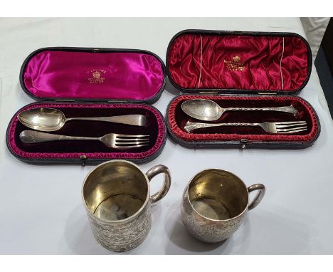 Two small antique silver christening mugs - sold with two cased silver spoon and fork christening sets - various dates, condi