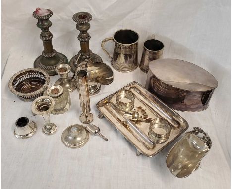 A box containing a quantity of silver plated items including a large oval caddy, candlesticks, tankards, etc.