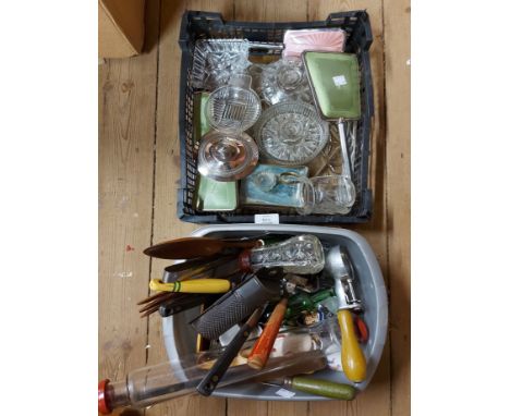 A crate containing components of a glass dressing table set including candlesticks, a vintage brush set, etc. - sold with a t