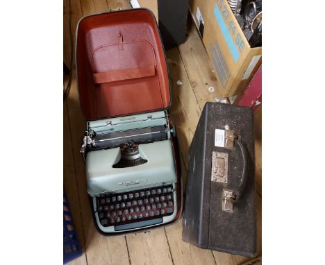 A cased Remington typewriter - sold with a cased Invicta typewriter