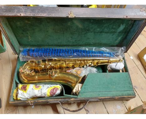 A vintage cased Pan American tenor saxophone