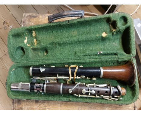 An old cased Hawkes &amp; Sons clarinet