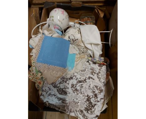 A box containing two ceramic lamp bases and quantity of vintage linen including tablecloths, etc.