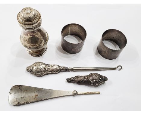 A silver baluster pepperette - sold with two silver napkin rings and a silver handled button hook and damaged shoehorn