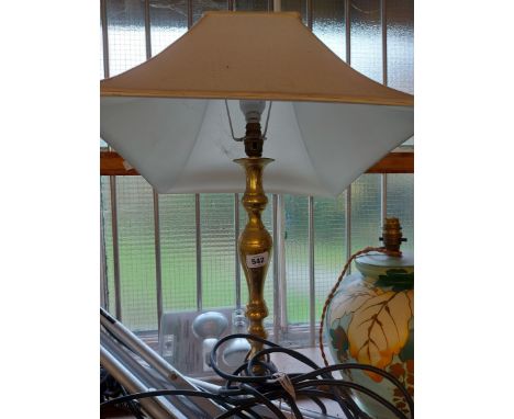 A heavy cast brass table lamp of candlestick form