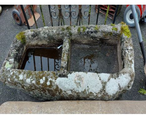 A 1.39m old granite trough with central partition