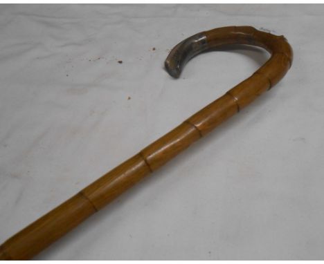 A walking cane with silver handle - sold with a smaller similar with yellow metal tip and a swagger stick with silver plated 