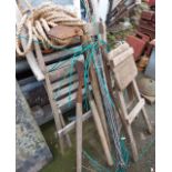A quantity of old garden tools, rope, weed sprayer, etc.- sold with a folding wooden garden chair
