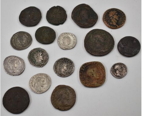 A collection of 16 Roman Imperial coins comprising of a Trajan silver denarius, Trajan brass dupondius, Trajan Greek Imperial