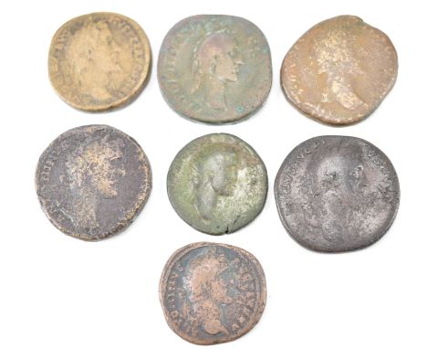 A collection of ancient Roman Imperial coins from the Reign of Antoninus Pius comprising of a Brass sestertius x 5, dupondius