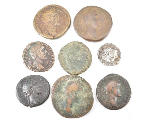 A collection of eight ancient Roman Imperial coins from the reign of Antoninus comprising of a silver denarius, sestertius x 
