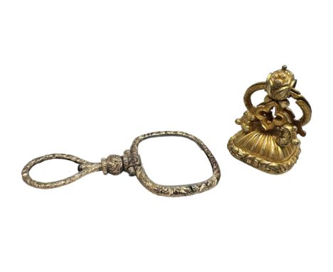 A large Victorian gilt metal seal fob with white stone monogram intaglio, and a gilt magnifying glass, 6.9cm