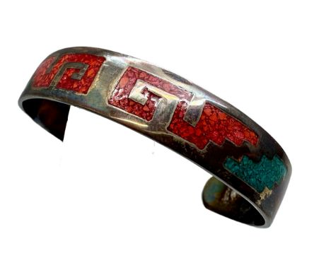 A Mexican silver bangle set with turquoise and coral, 16.5g, 6 x 4.4cm