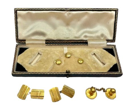 A pair of 9ct gold cufflinks and three 9ct gold shirt studs, 5.3g, together with a yellow metal stud on chain with Oriental m