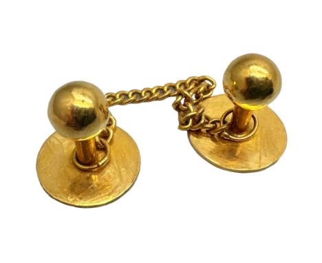 A pair of yellow metal shirt studs with Oriental marks, 4.1g