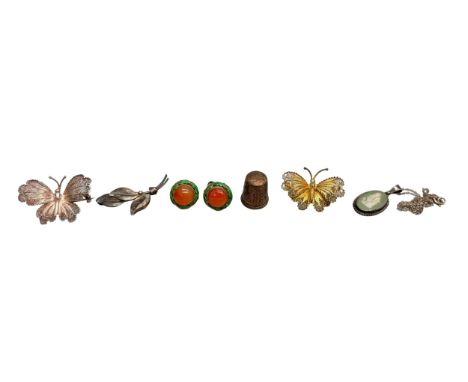 A pair of Chinese cloisonne silver gilt earrings with screw backs, two filigree butterfly brooches, a silver mounted Wedgwood