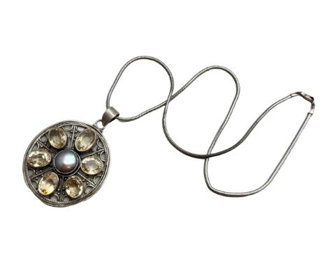 An Arts and Crafts style silver, citrine and blister pearl pendant on a silver chain, 35g, 6cm pendant, 46cm chain