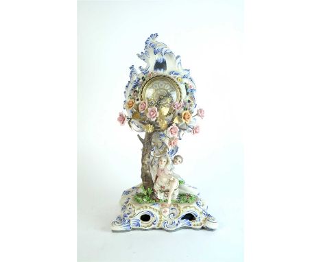 An Italian porcelain mantel timepiece by Luigi Fabris, early 20th century, the dial surmounted by flowers and blue rococo sty
