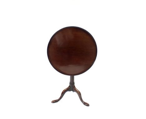 A 20 th century mahogany snap top tripod table, the shallow tray top with fluted border on a pivoting birdcage alignment, cyl