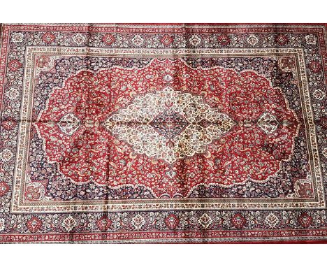 A red ground Kashmir carpet with tradition medallion design, 200 x 300cm