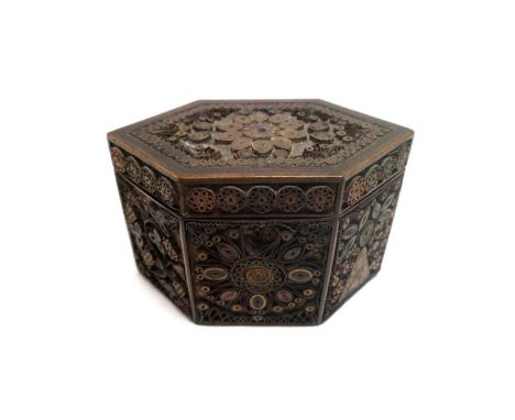 A regency curled paper tea caddy, of pointed rectangular form, intricately decorated with symmetrical foliate and floral moti