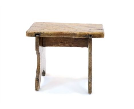 A small milking stool, the planked elm top above a pair of shaped oak splat supports united by a single pine stretcher, 26 cm