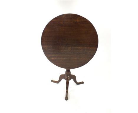 A 19th century oak snap-top tripod table, the circular top raised on a turned column with three bladed tapering swept legs, 7