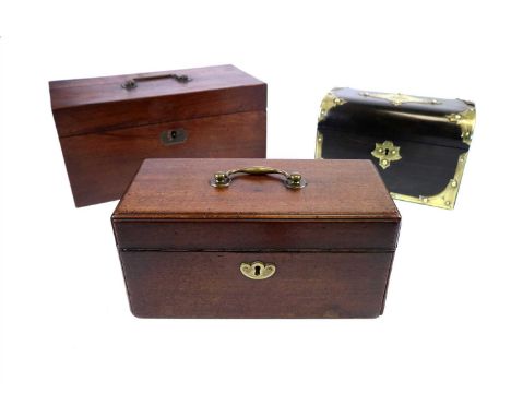 A George III mahogany tea caddy of rectangular form, the hinged cover with a looping brass handle opening to reveal a divisio