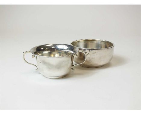 A silver bon bon dish, Holland, Aldwinckle &amp; Slater, London 1897, of plain polished circular form with two scroll loop ha