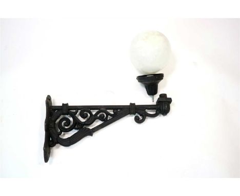 A set of four painted cast iron wall lamp brackets (two pairs), with scrolling pierced mounts, contemporary, each measuring 7