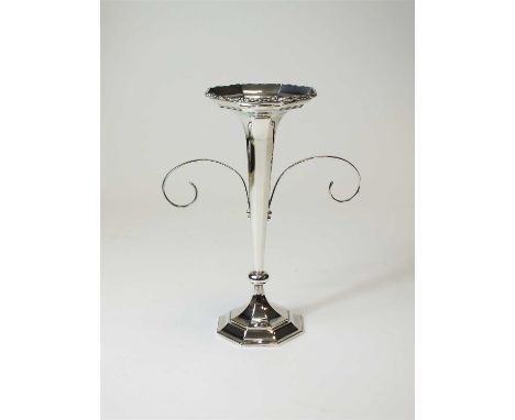 A silver trumpet vase, William Hutton &amp; Sons Ltd, Sheffield 1928, of tapered faceted from with applied scroll decoration 