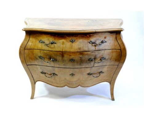 An Italian walnut and boxwood inlaid Bombe commode, the serpentine top with foliate border above three deep drawers with gilt