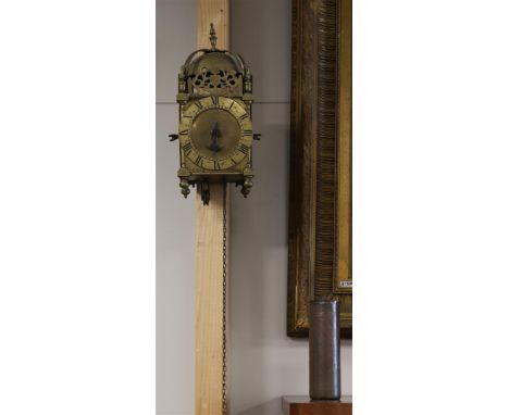 A lantern clock, England, address: Uriah King, 18th century (pendulum missing).