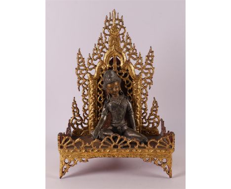 A silver-plated bronze Buddha on a loose gilded throne, India 19th/20th century, h 36 cm, to. 2x.